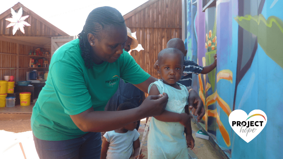 Children shoes in the preschool playground. Happy feet: Project Hope, SA.