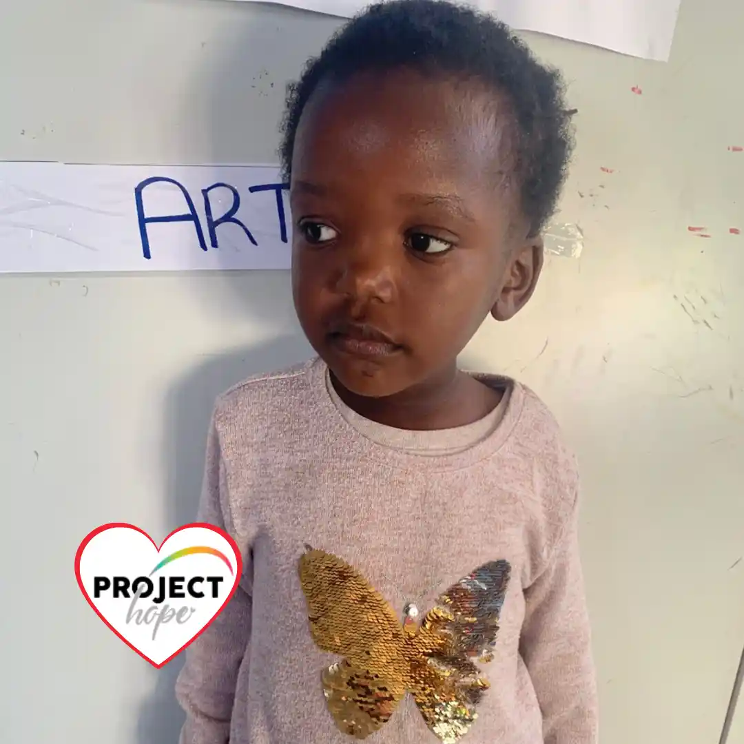 A healthy three-year-old girl named Olive who recovered from negative effects of malnutrition through early childhood development support.