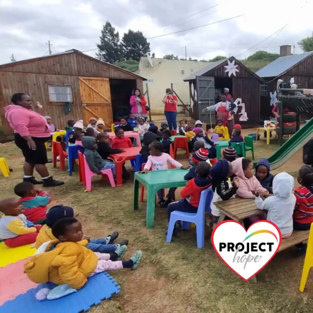 experienced-nonprofit-organisation-project-hope-ecd Teachers and preschool children interact outside their classroom at a Project Hope partner centre.